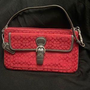 Red Coach wristlet with brown trim